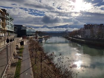 Bridge over river with buildings in background