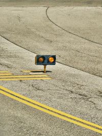 Yellow arrow symbol on road