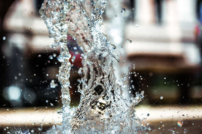 Close-up of water drops on blurred background