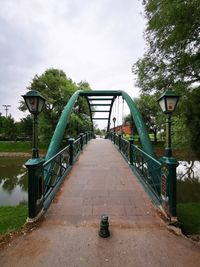 Bridge in park against sky