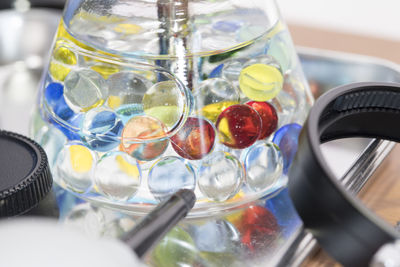 Close-up of colorful jelly balls in glass container