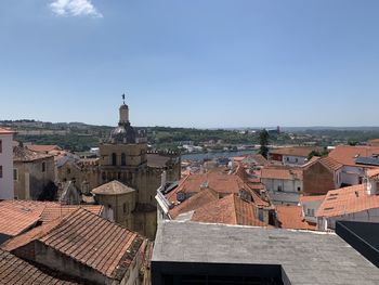 Buildings in town against clear sky