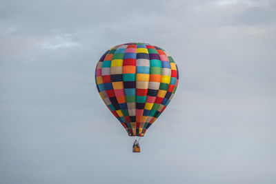 Low angle view of hot air balloons against sky