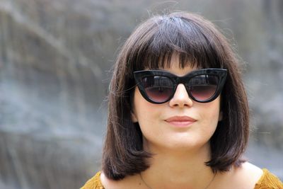 Close-up of portrait young woman wearing sunglasses