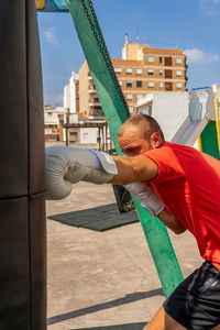 Man exercising on punching bag