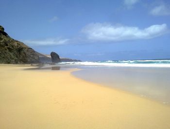 Scenic view of beach against sky