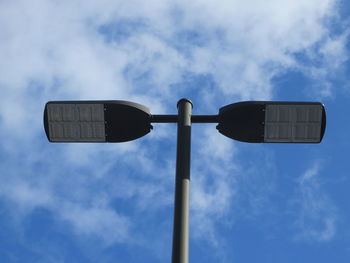 Low angle view of street light against sky