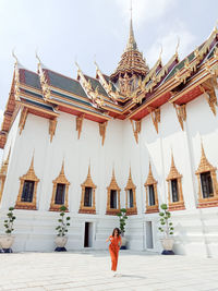Full length of woman standing at temple