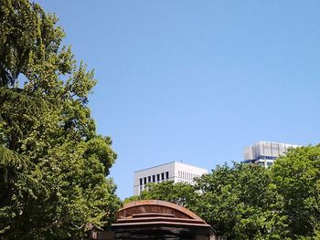 Low angle view of building against clear blue sky