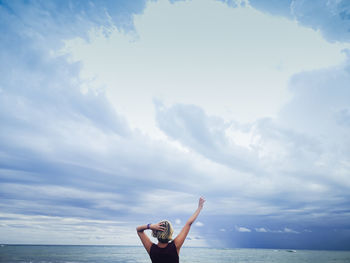 Full length of person in sea against sky