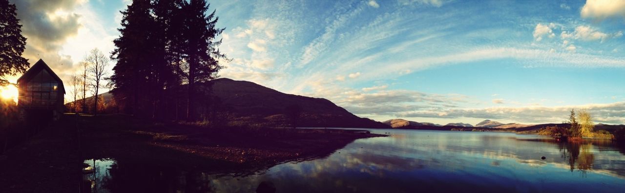 sky, water, cloud - sky, tranquil scene, scenics, mountain, tranquility, beauty in nature, cloud, lake, nature, reflection, mountain range, cloudy, idyllic, panoramic, tree, sunset, non-urban scene, rock - object