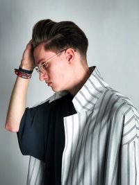 Close-up of young man against white background