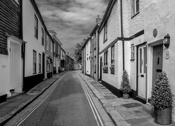 Empty alley amidst buildings in city