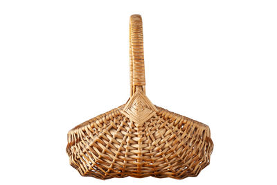 Close-up of wicker basket against white background