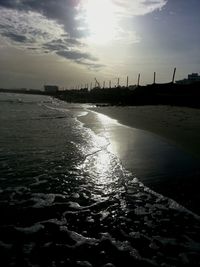 Scenic view of sea against cloudy sky