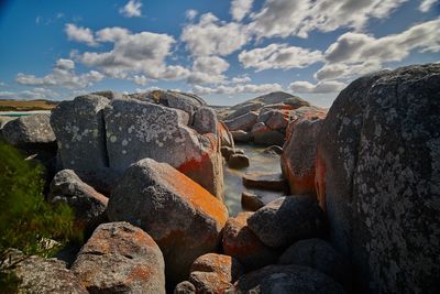 Panoramic shot of rocks on land against sky