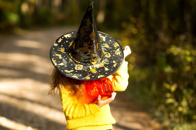 Rear view of woman wearing hat