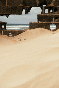 Surface level of beach against sky