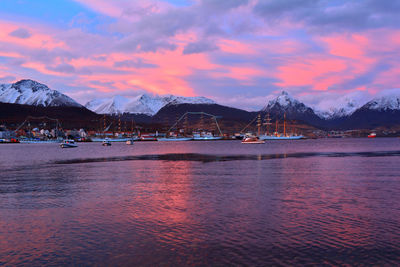 Scenic view of snowcapped mountains against sky during sunset