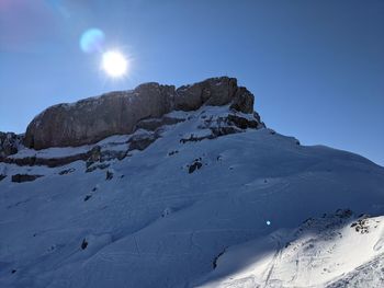 Scenic view of snow covered mountain against sky