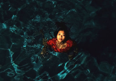 Portrait of young woman in swimming pool