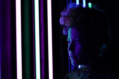 Model with pin up hairstyle with neon lights