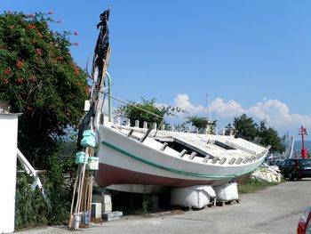 Boats in river against sky