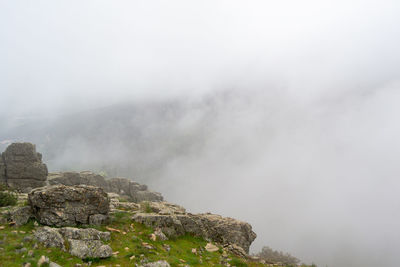 Rocky mountains on a foggy day at el escorial mountain in madrid in spain. horizontal photography