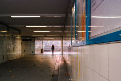 Man walking in subway tunnel