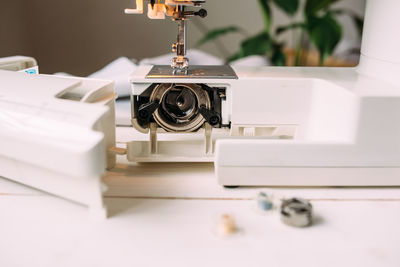 Sewing machine, accessories and fabric. cozy creative sewing process at home