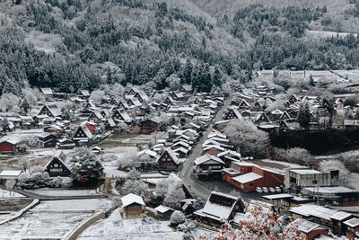 High angle view of trees and buildings during winter