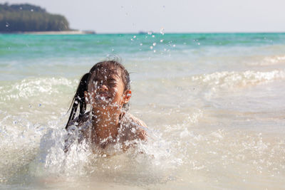 Girl playing in sea