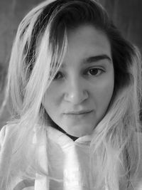 Close-up portrait of young woman with long hair 