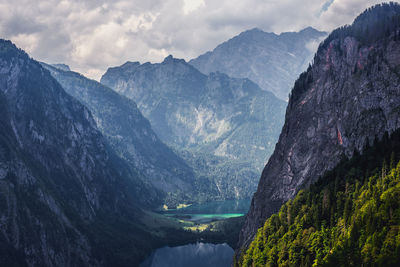 Scenic view of mountains against cloudy sky