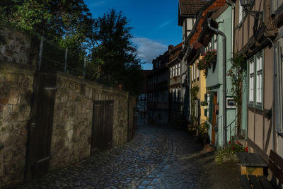 Street amidst buildings against sky