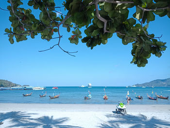 Scenic view of sea against blue sky