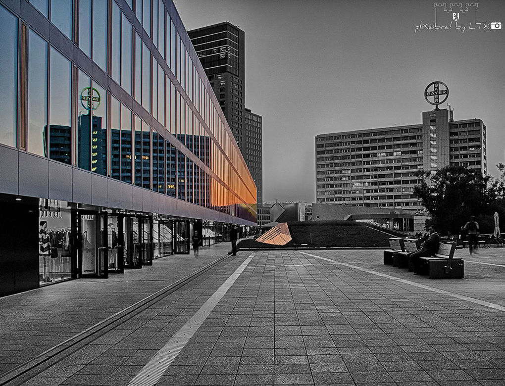 architecture, building exterior, built structure, city, building, street, transportation, the way forward, sky, incidental people, city life, street light, day, modern, office building, outdoors, sidewalk, road, city street, diminishing perspective