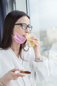 Portrait of woman holding ice cream