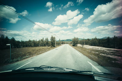 Road seen through car windshield