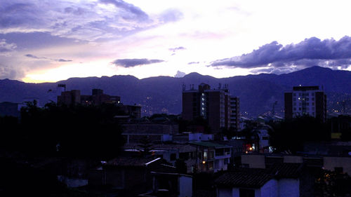 High angle view of cityscape against cloudy sky