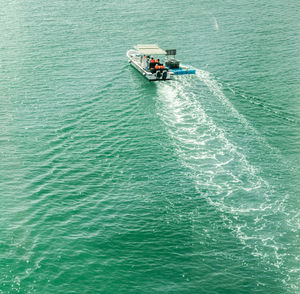 High angle view of boat sailing on sea