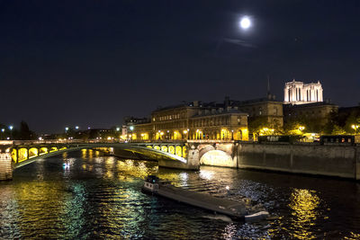 The seine river with boat illuminated at night
