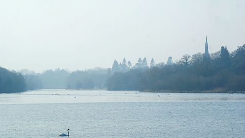 Scenic view of landscape against sky during winter