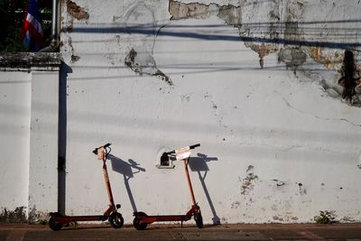 Side view of bicycles on wall