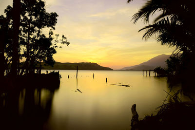 Scenic view of lake against sky during sunset