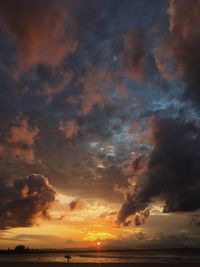 Scenic view of dramatic sky over sea