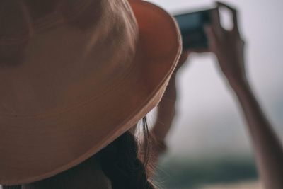 Rear view of woman wearing hat