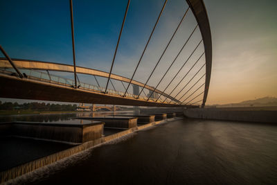 Bridge over river against sky