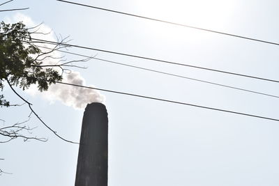 Low angle view of cables against clear sky