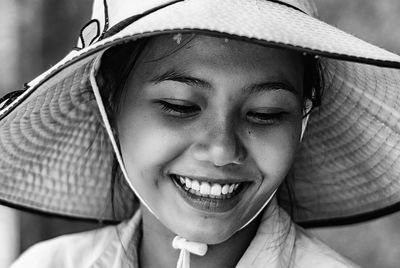 Close-up of smiling woman in hat